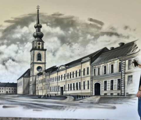 Nástenná maľba s budovou a vežou na paneli v Senici
